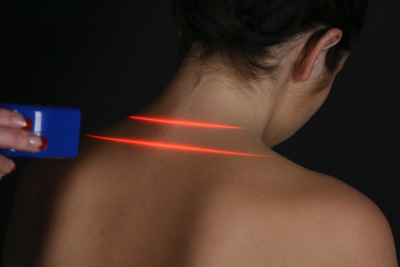 The Erchonia laser being used to treat a patient's neck. 