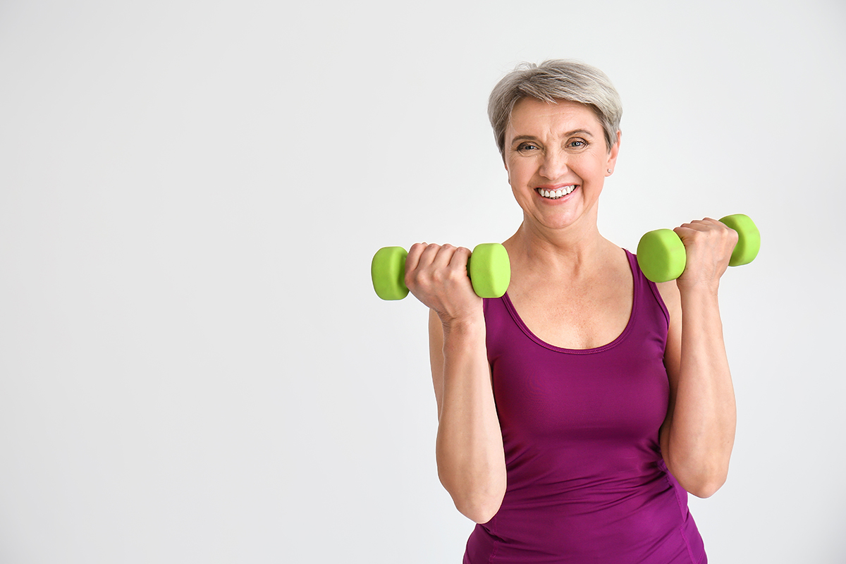 A woman working out with weights.