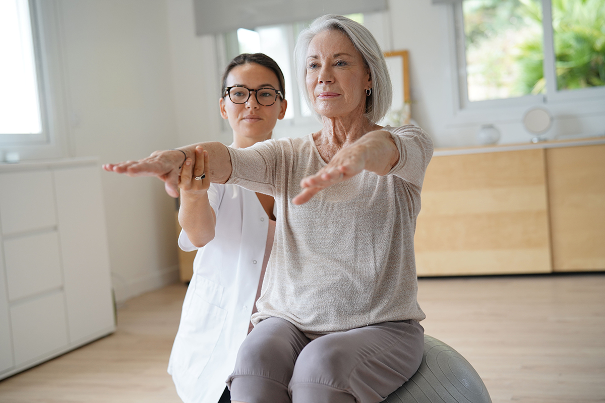 A woman balancing on an exercise ball.