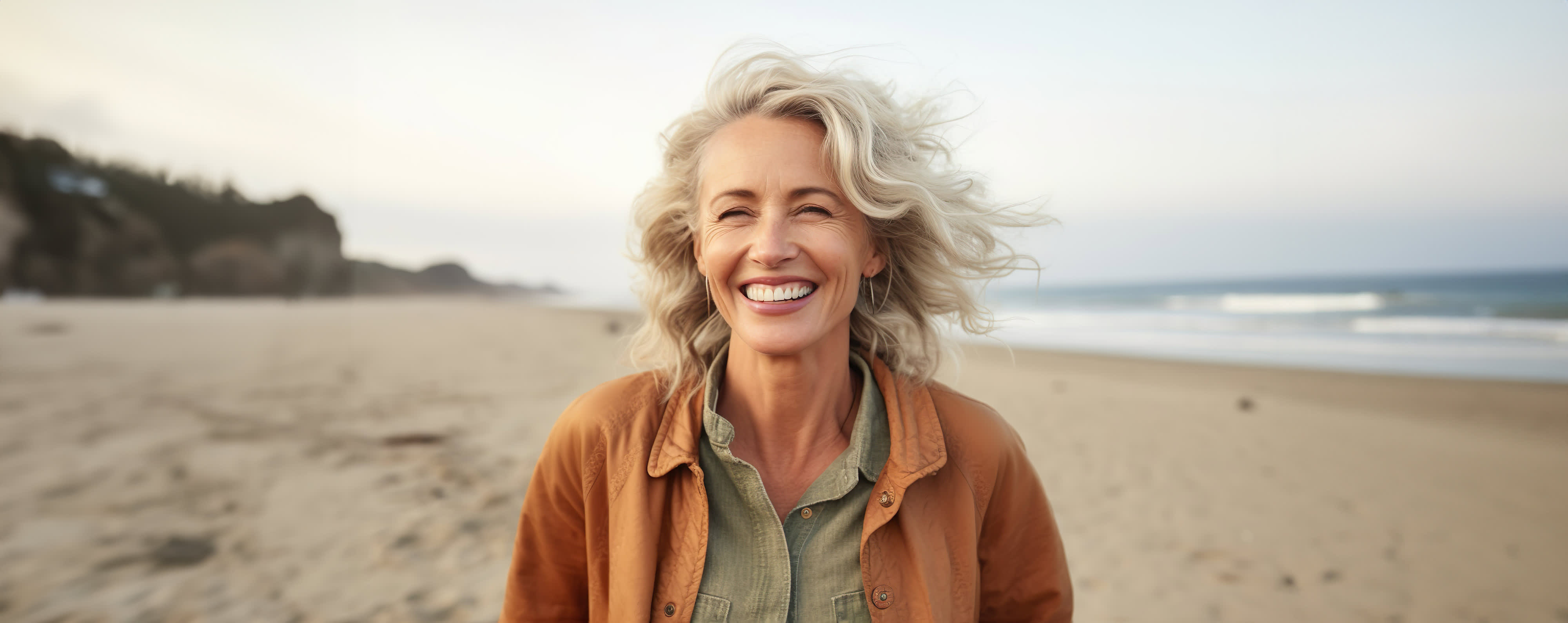 A woman standing on the beach.