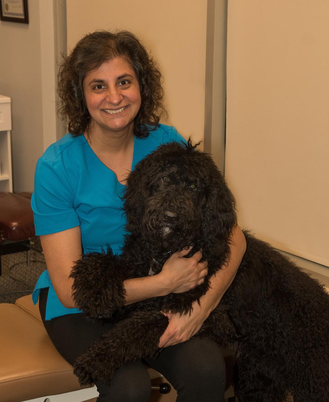 Dr. Alma with her dog Shadow.